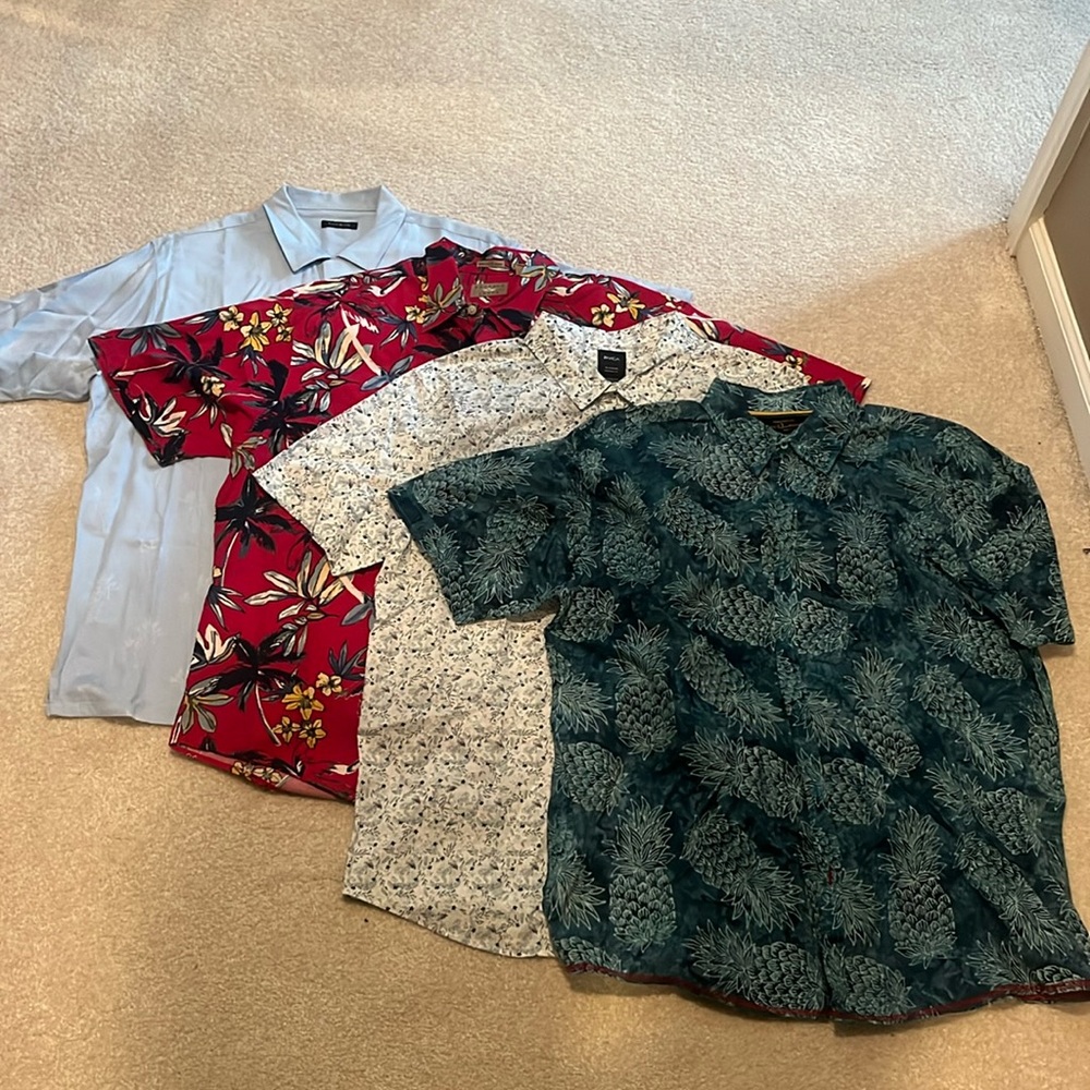 4 men’s short sleeve button up vacation shirts.